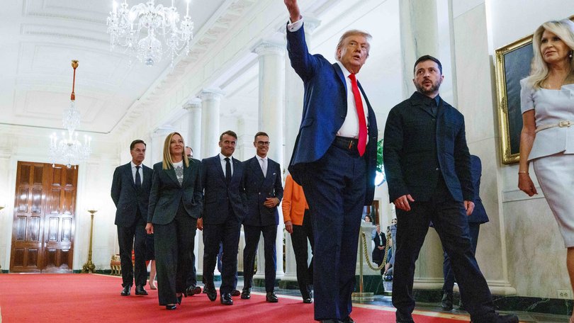 United States President Donald J Trump leads President Volodymyr Zelensky of Ukraine and the European and NATO leaders in Cross Hall of the White House in Washington.