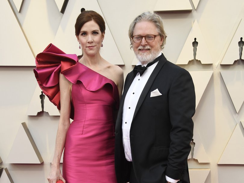 Tony McNamara with his wife, actor Belinda Bromilow at the Oscars in 2019.