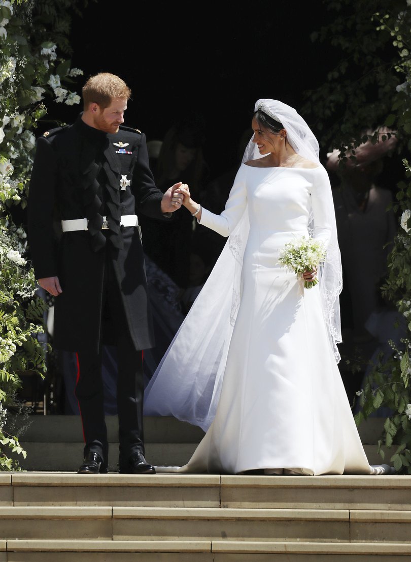 The Duke and Duchess of Sussex walk down the steps of St George's Chapel at Windsor Castle.