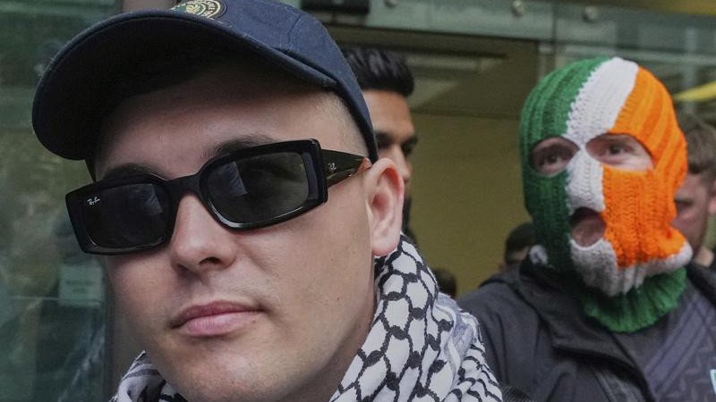 Liam ?g ? hAnnaidh was greeted by hundreds of fans as he arrived at Westminster Magistrates' Court.