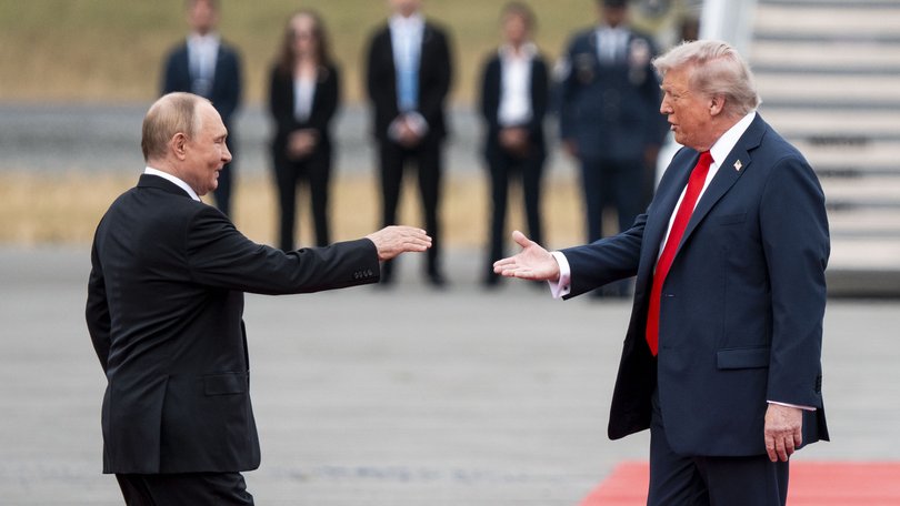 President Donald Trump greets President Vladimir Putin of Russia as they met in Alaska.
