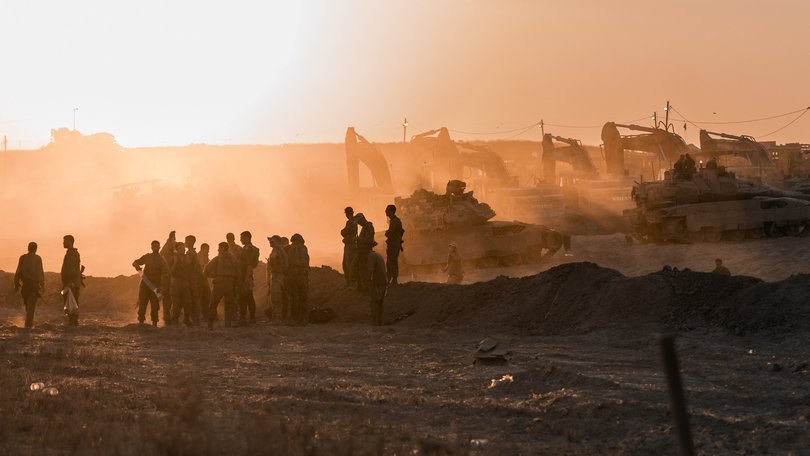 IDF soldiers prepare tanks near the Gaza Strip's northern border.