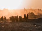 IDF soldiers prepare tanks near the Gaza Strip's northern border.