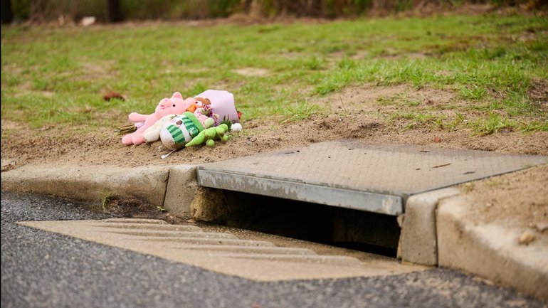 The infant's body was found in a stormwater drain by two workers carrying out routine maintenance.