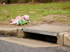 The infant's body was found in a stormwater drain by two workers carrying out routine maintenance.