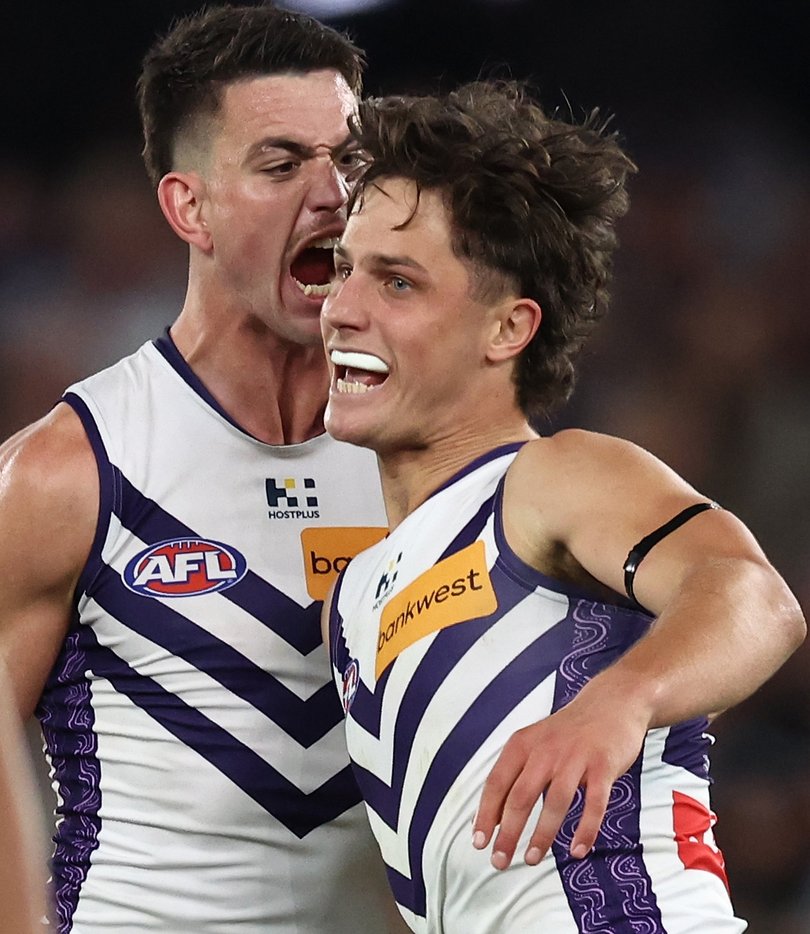 MELBOURNE, AUSTRALIA - AUGUST 24: Neil Erasmus of the Dockers celebrates a goal with Patrick Voss during the 2025 AFL Round 24 match between the Western Bulldogs and the Fremantle Dockers at Marvel Stadium on August 24, 2025 in Melbourne, Australia. (Photo by James Wiltshire/AFL Photos)