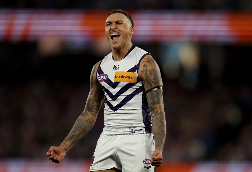 Shai Bolton of the Dockers celebrates kicking a goal.