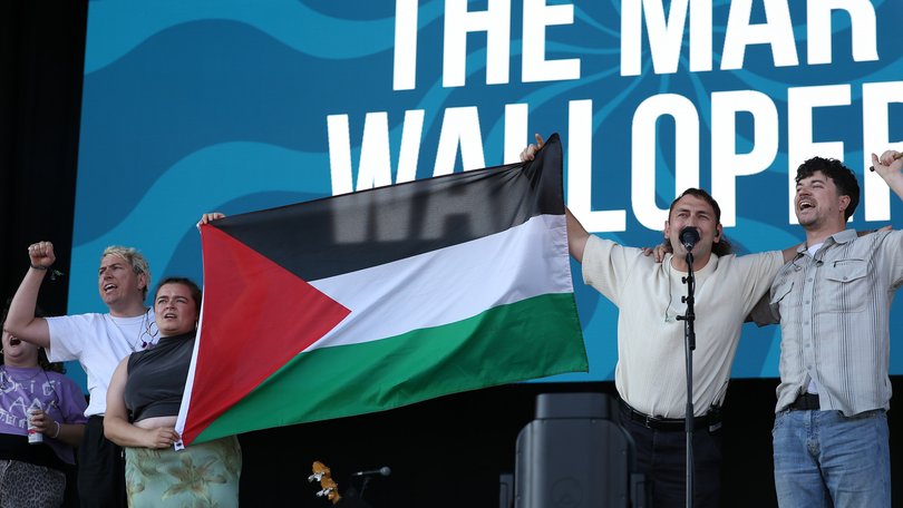 The Mary Wallopers hold a Palestinian flag as they protest onstage during day one of the Victorious Festival in England.