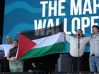 SOUTHSEA, ENGLAND - AUGUST 22: The Mary Wallopers hold a Palestinian flag as they protest onstage during Day 1 of Victorious Festival on August 22, 2025 in Southsea, England. (Photo by Harry Herd/WireImage)