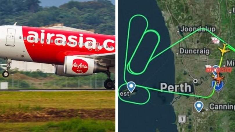 A Bali-bound plane was forced to turn back to Australia after flames were seen coming from its engine.