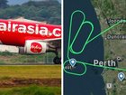 A Bali-bound plane was forced to turn back to Australia after flames were seen coming from its engine.