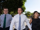 Outback Wrangler Matt Wright and his wife Kaia Wright alongside his instructing solicitor Luke Officer approaching the Supreme Court in Darwin.