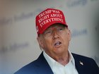WASHINGTON, DC - AUGUST 22:  U.S. President Donald Trump speaks to the media wearing a hat that reads, "Trump Was Right About Everything!," during a visit to The People's House: A White House Experience August 22, 2025 in Washington, DC.  Trump spoke on a variety of issues including stating he did not know of the FBI raid currently happening on former national security adviser John Bolton's home, and saying he learned of it by seeing the news on television.  (Photo by Kevin Dietsch/Getty Images)