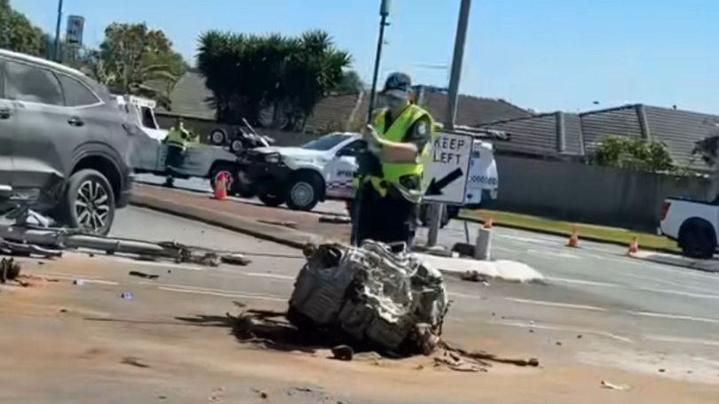 Parts of the car were flung onto the road.