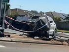 A man is fighting for life after a horror crash left a car split in half at Logan Reserve. 
