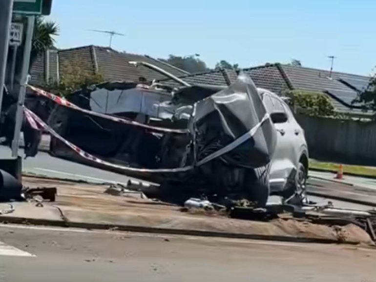 A man is fighting for life after a horror crash left a car split in half at Logan Reserve. 