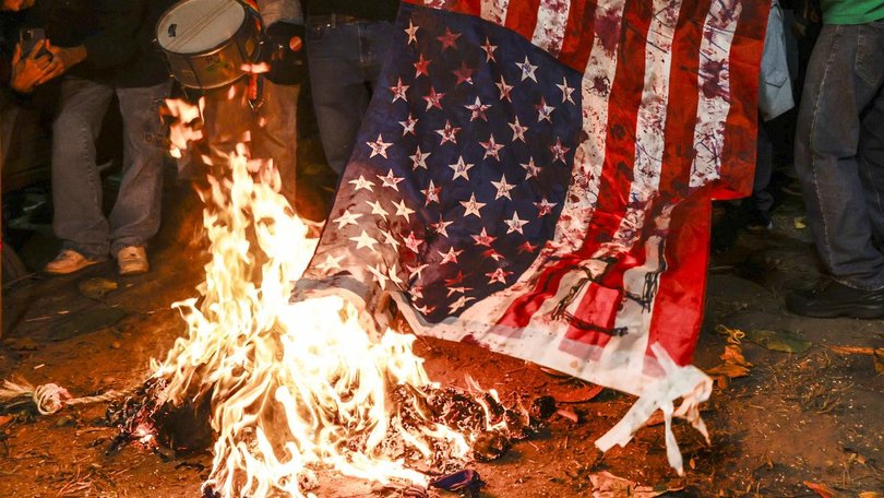 Tne burning of the flag is protected under the US Constitution, despite Donald Trump's claims. (EPA PHOTO)