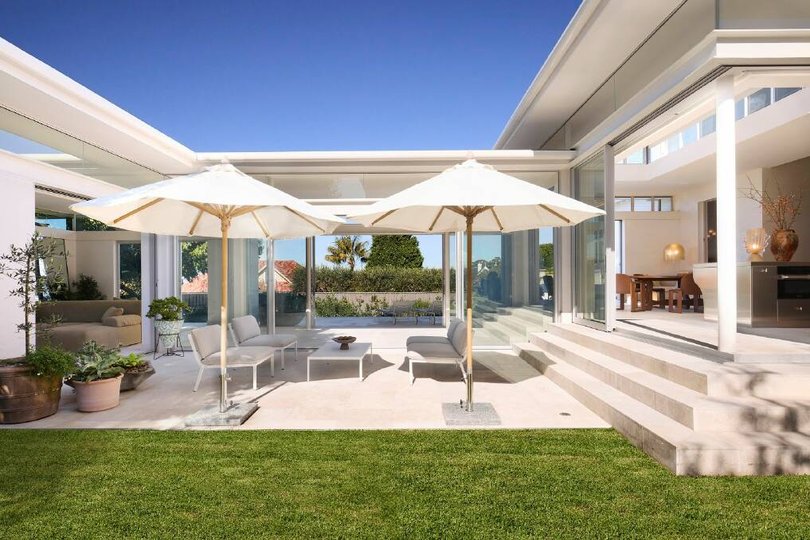 The breezeway overlooks the terrace and pool.