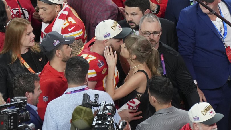 Taylor Swift kisses Kansas City Chiefs tight end Travis Kelce after the Chiefs won Super Bowl LVIII in Las Vegas on February 11, 2024.