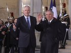 France's outgoing Prime Minister Michel Barnier, left, and France's newly appointed Prime Minister Francois Bayrou in December 2024.