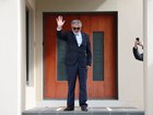 Iranian ambassador to Australia Ahmad Sadeghi waves outside his residence, after being expelled on Tuesday.