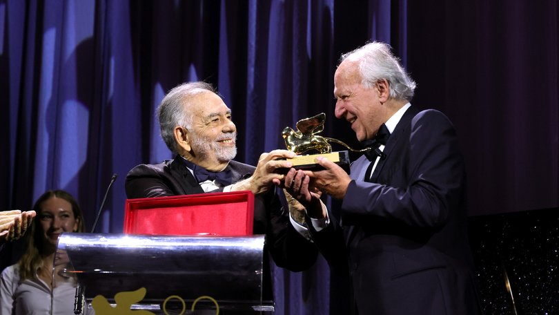Werner Herzog, right, receives the Golden Lion for Lifetime Achievement Award from Francis Ford Coppola during the opening ceremony of the 82nd Venice International Film Festival.