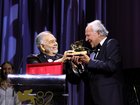 Werner Herzog, right, receives the Golden Lion for Lifetime Achievement Award from Francis Ford Coppola during the opening ceremony of the 82nd Venice International Film Festival.