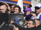 Police shielded Argentine President Javier Milei and his sister as objects were thrown at them. 
