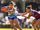 Ash Riddell of the Kangaroos is tackled by Kiara Bowers.