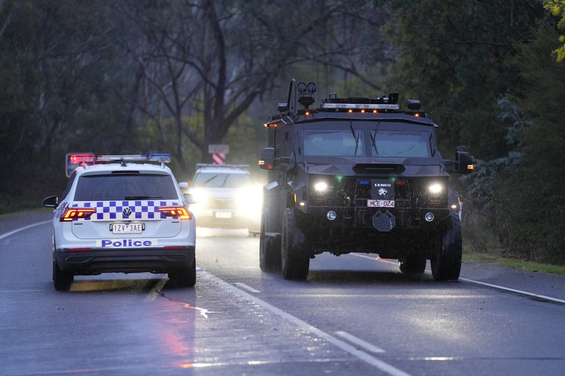 A large contingent of Victorian Police, including the armed heavy vehicles used by the Tactical Operations Unit in Porepunkah.