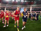 Nick Riewoldt and Luke Hodge lead their sides out in the Legends Game clash.