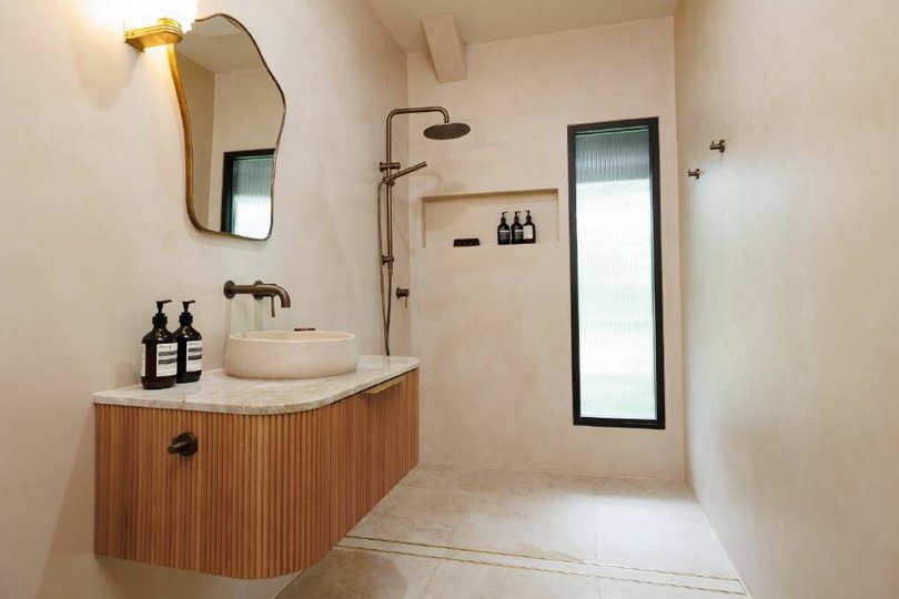 The home features luxurious bathrooms.