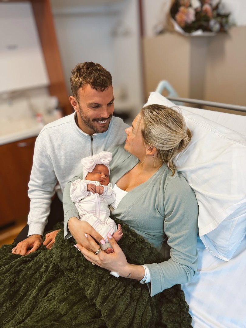 The proud parents with their newborn. 
