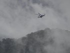 Harsh weather in Victoria's alpine region is complicating the hunt for an accused cop killer. 