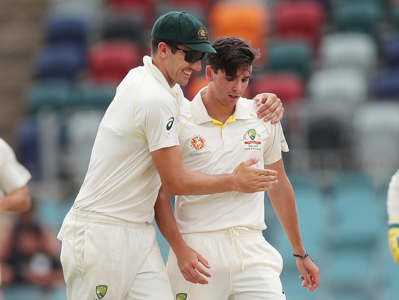 Pat Cummins congratulates Jhye Richardson on his first wicket on Test debut. Picture. Phil Hillyard