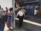 People wait for loved ones to be deported from the US, outside Guatemala City's airport. (AP PHOTO)