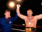 Joe Bugner celebrates after beating James "Bonecrusher" Smith for the WBF heavyweight crown. (AP PHOTO)