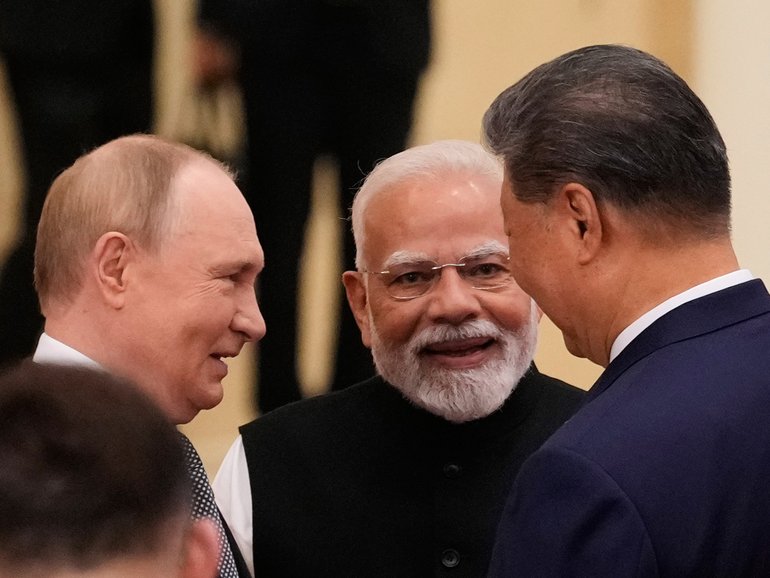 Vladimir Putin, Narendra Modi and Xi Jinping talk ahead of the Shanghai Cooperation Organisation summit.