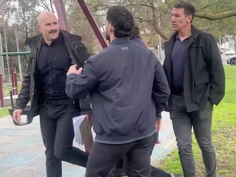Self-proclaimed neo-nazi Thomas Sewell (left) at Premier Jacinta Allan's press conference.
