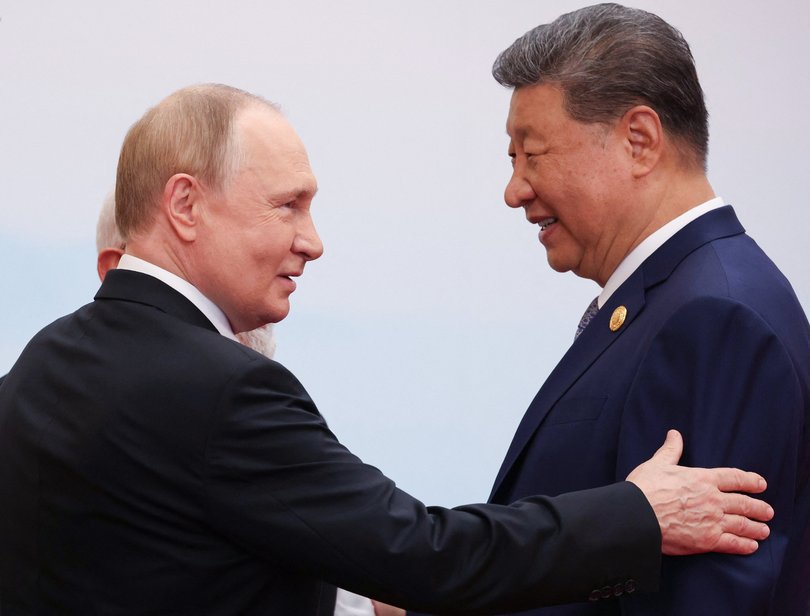 In this pool photograph distributed by the Russian state agency Sputnik, Russia's President Vladimir Putin (front L) speaks with India's Prime Minister Narendra Modi (C) and China's President Xi Jinping during the Shanghai Cooperation Organisation (SCO) Summit in Tianjin on September 1, 2025.