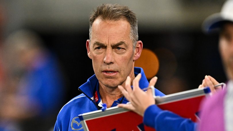 Alastair Clarkson presented to Tasmania Football Club has part of a contract obligation.