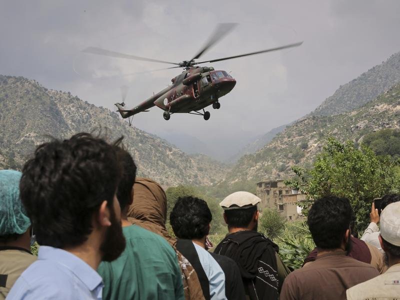 Helicopters have been rushing in aid and carrying injured people to hospital after Monday's quake. (AP PHOTO)