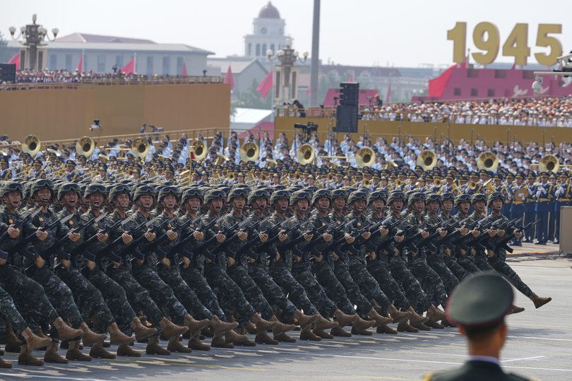 Military personnel take part in a military parade to commemorate the 80th anniversary of Japan's World War II surrender.