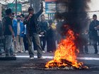 Students from the Indonesian Islamic Student Movement  burn tires as they block a main provincial road in Sleman, Yogyakarta.