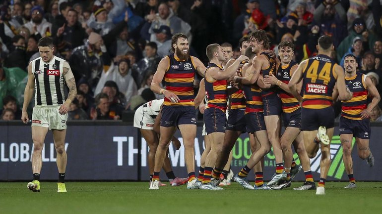 Adelaide players celebrate their narrow win over Collingwood three weeks ago.
