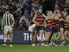 Adelaide players celebrate their narrow win over Collingwood three weeks ago.