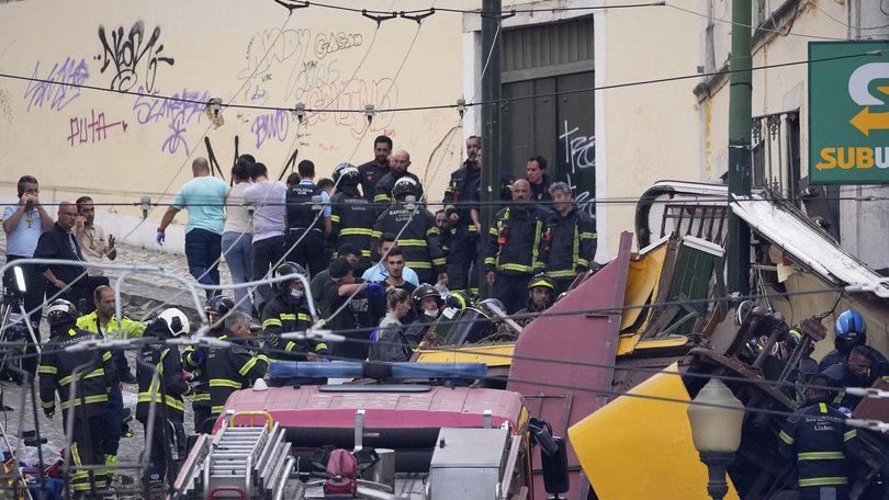Fifteen people died after a yellow Lisbon funicular, which goes up and down a city hill, crashed. (AP PHOTO)