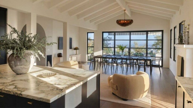 The property includes grand architectural details including arched hallways and exposed wooden beams. Pic: Tyler Hogan.