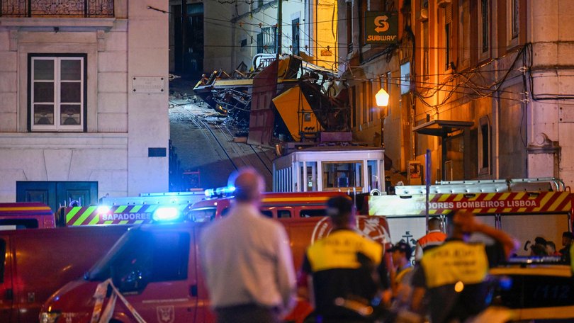 Firefighters at the scene of the tram crash.