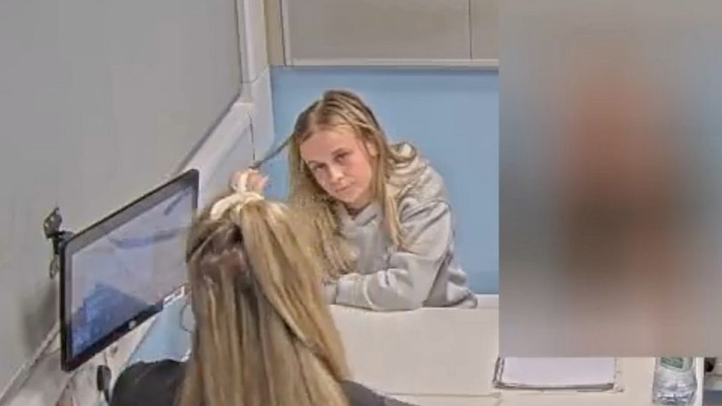 Footage shows a calm, unbothered nursery worker.